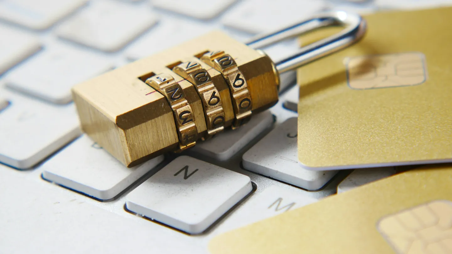 Gold padlock on a laptop keyboard