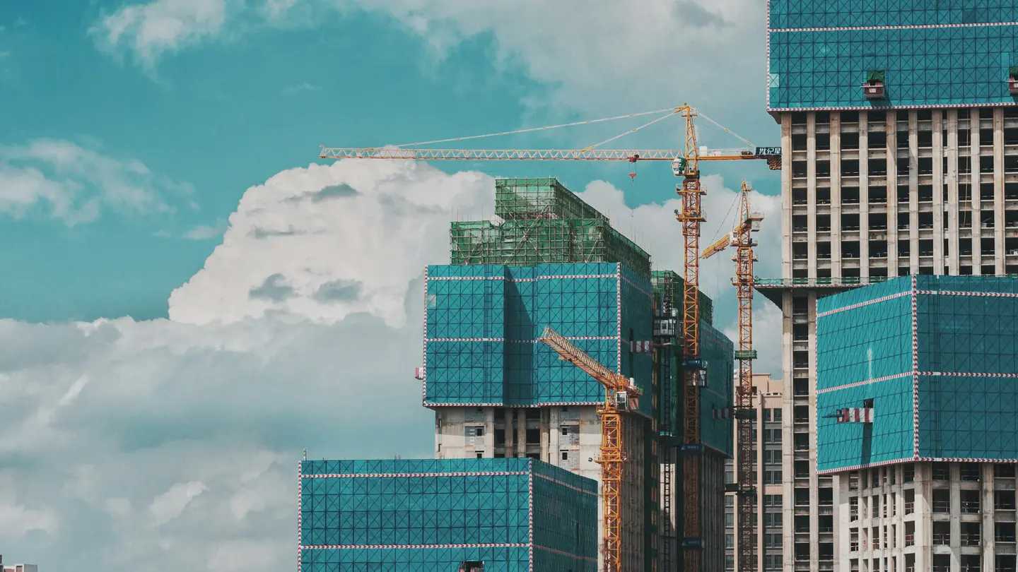 Towers under construction with tower cranes