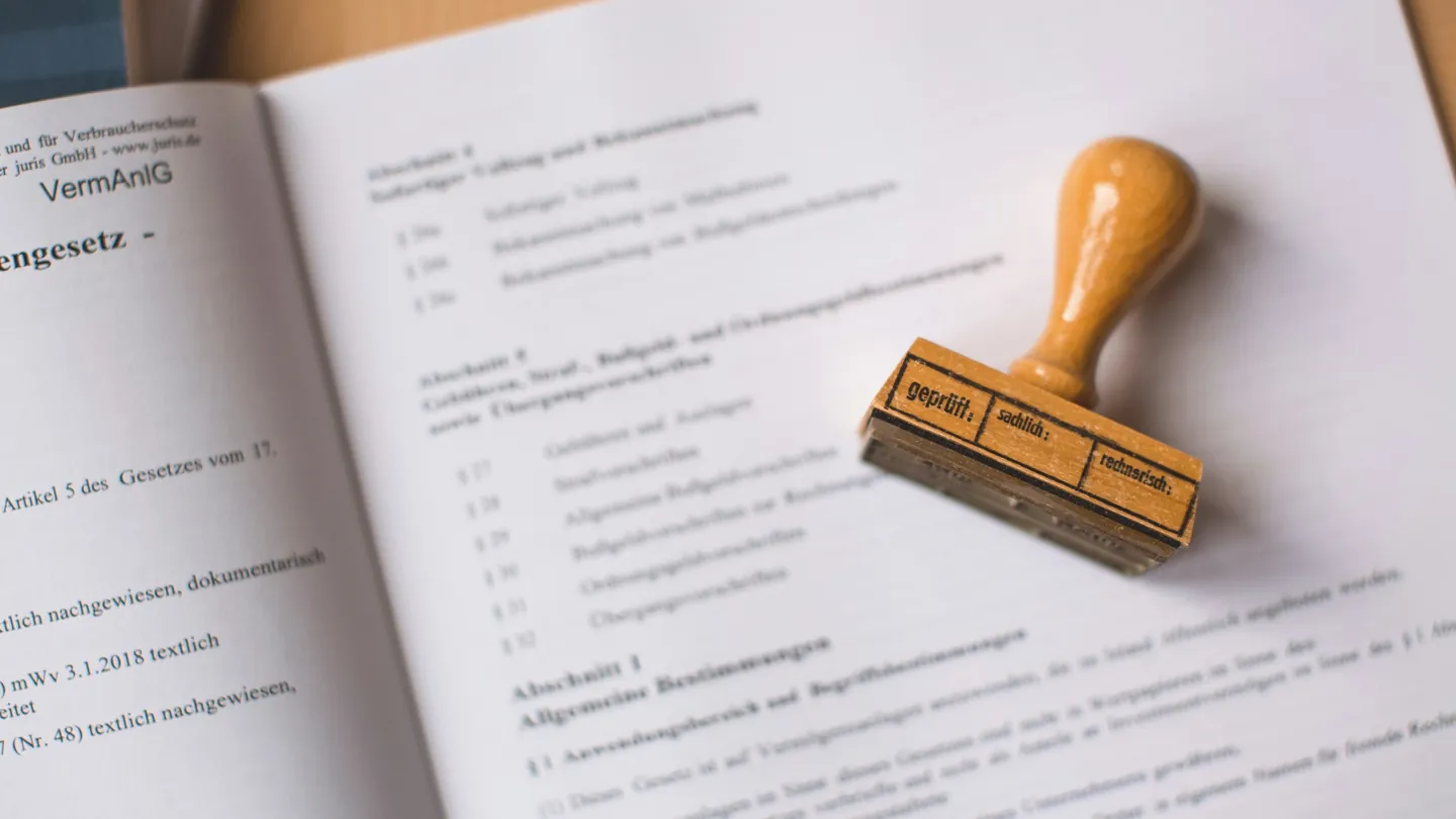 Rubber stamp on an open official document