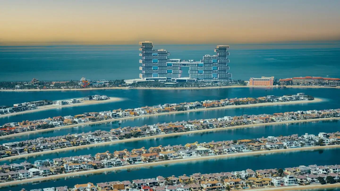 Aerial view of the Palm Jumeirah fronds and a resort on its outer crescent