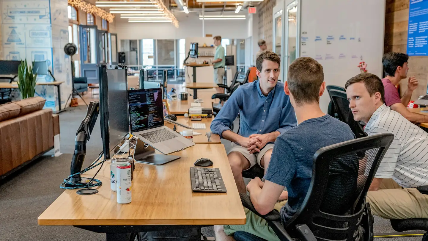 Employees at work in an open-plan office