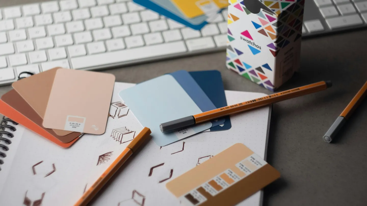 Designer’s desk with colour swatches and sketches